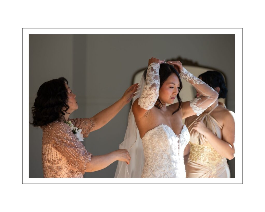 Sharlene’s mother adjusting her veil as Sharlene gets ready before the wedding ceremony at The Preserve at Canyon Lake