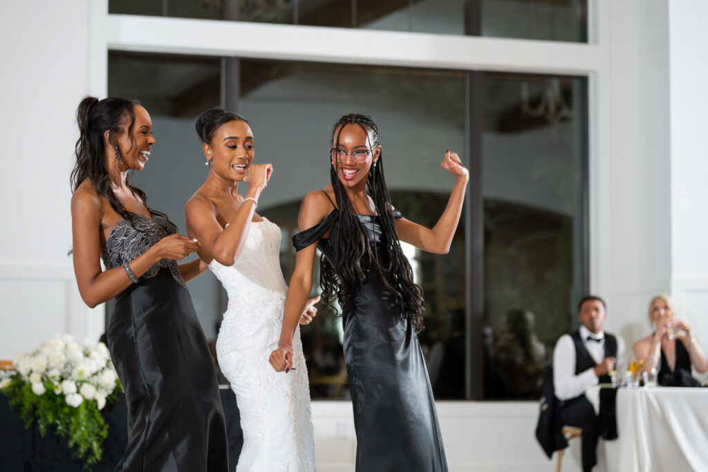 Jordan dancing with her mother and sister at the wedding reception