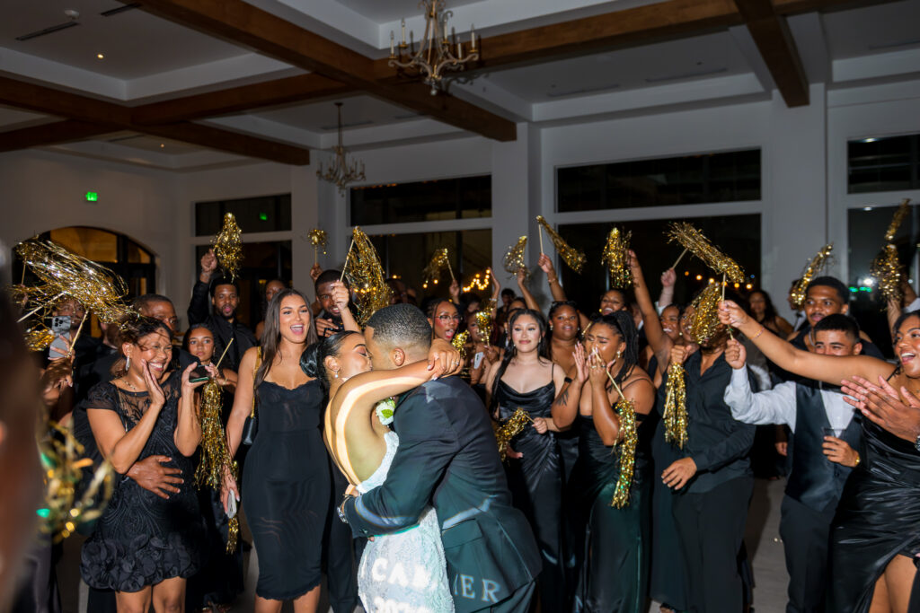 Jordan and Cameron surrounded by guests on the dance floor